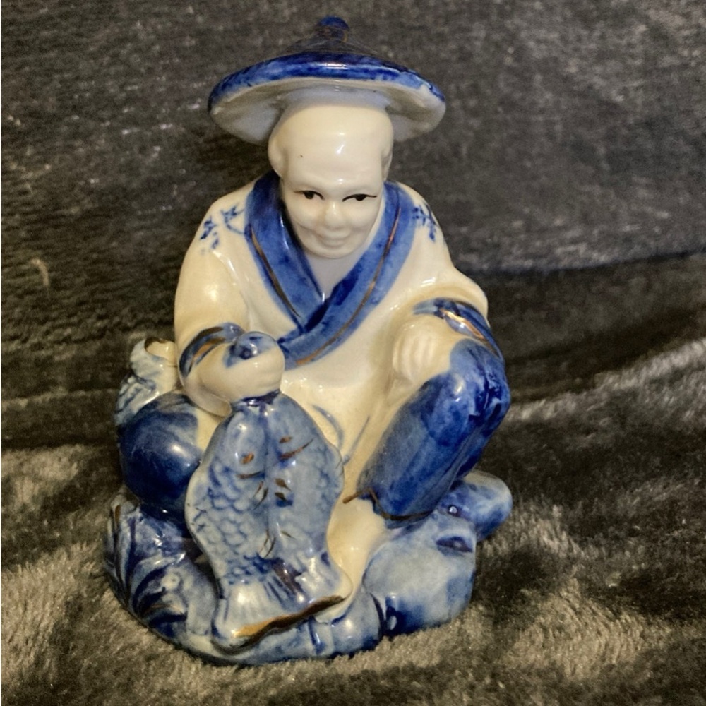 Blue and White Ceramic Fisherman Figurine